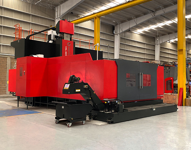 Instalaciones de producción de Taza Polymer mostrando la máquina Omnitec VXL-42X.