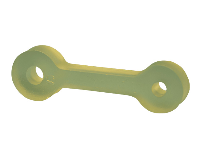 Componente industrial de polímero de ingeniería de color beige, con un diseño de forma de hueso con orificios, diseñado para la protección de maquinaria.